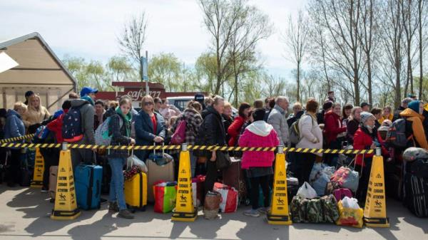 Ukrainian refugees are seen waiting for to cross the border, inside the tent placed at the Ukrainian side of the border in Palanca, Ukraine/Moldova, on 9 April 2022.